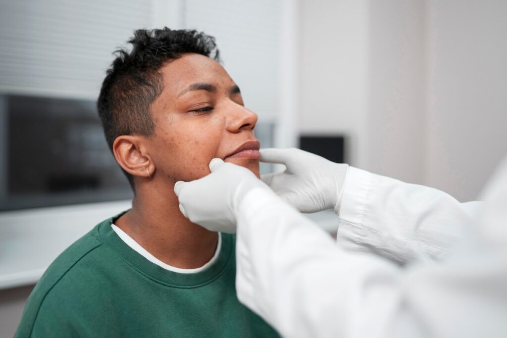 Dentist performing myofunctional therapy.
