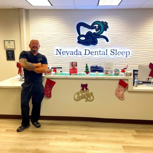 Dr. Hu Standing in Front of Reception Area